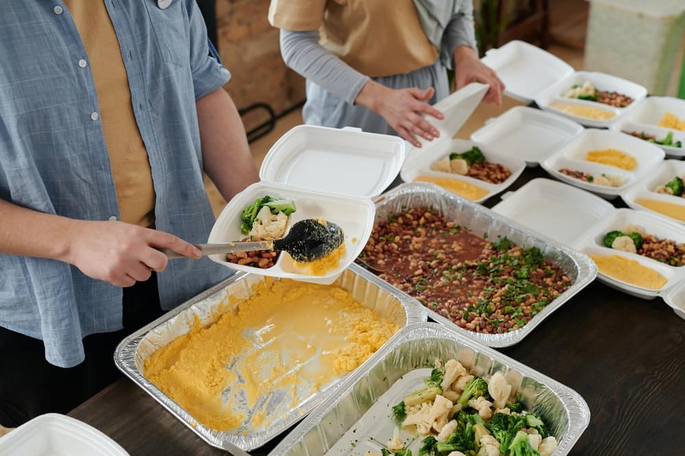 Hot meals being packed into boxes
